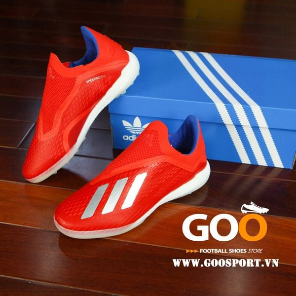 Hình ảnh Giày đá bóng Adidas X18+ màu đỏ đen trên sân cỏ nhân tạo