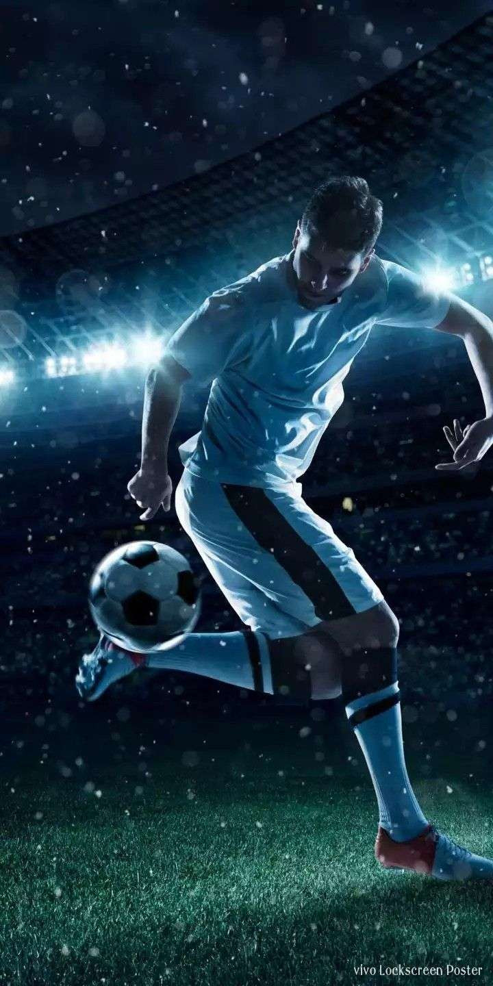 Hình nền cầu thủ bóng đá với áo đấu xanh
