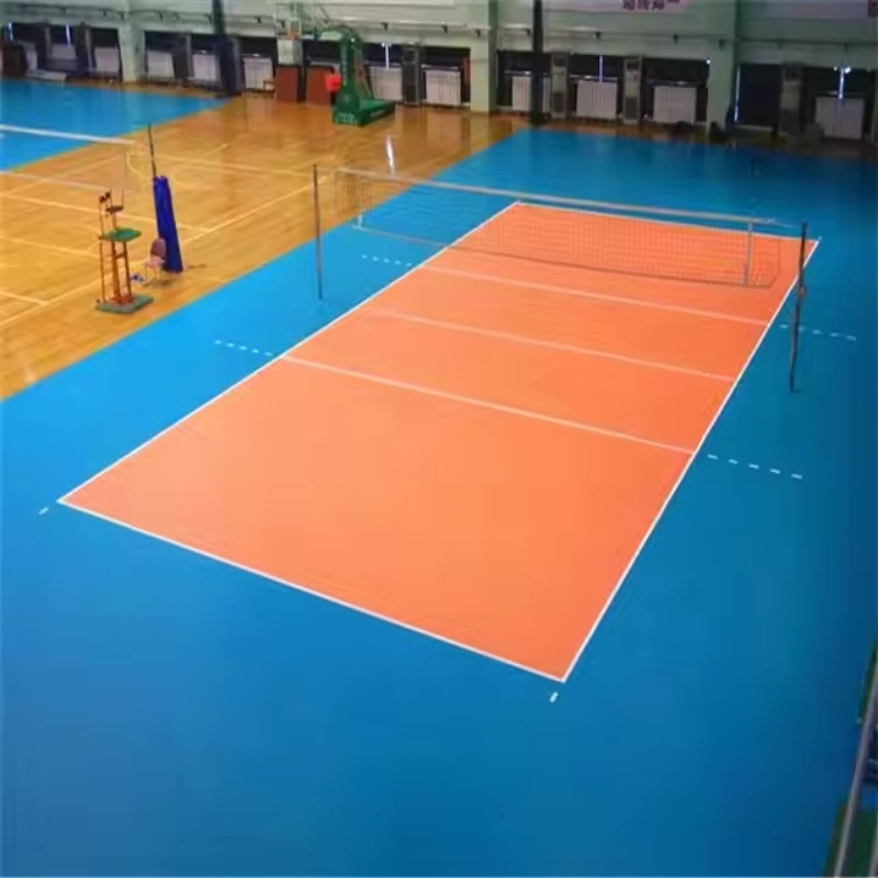 Hình nền sân bóng chuyền trong nhà nổi bật với màu cam và xanh dương